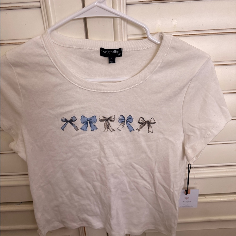 White T-Shirt with Blue and Gray Bow Design